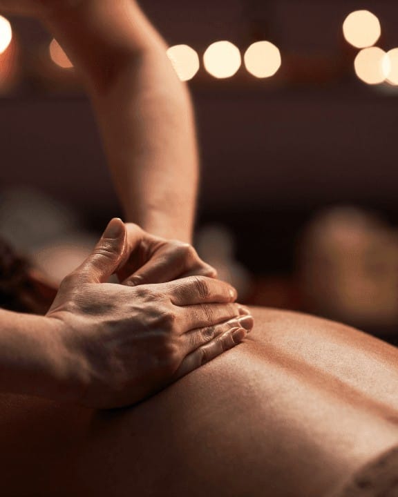 A warm, candlelit full-body massage during The Radiance Ritual at Selph